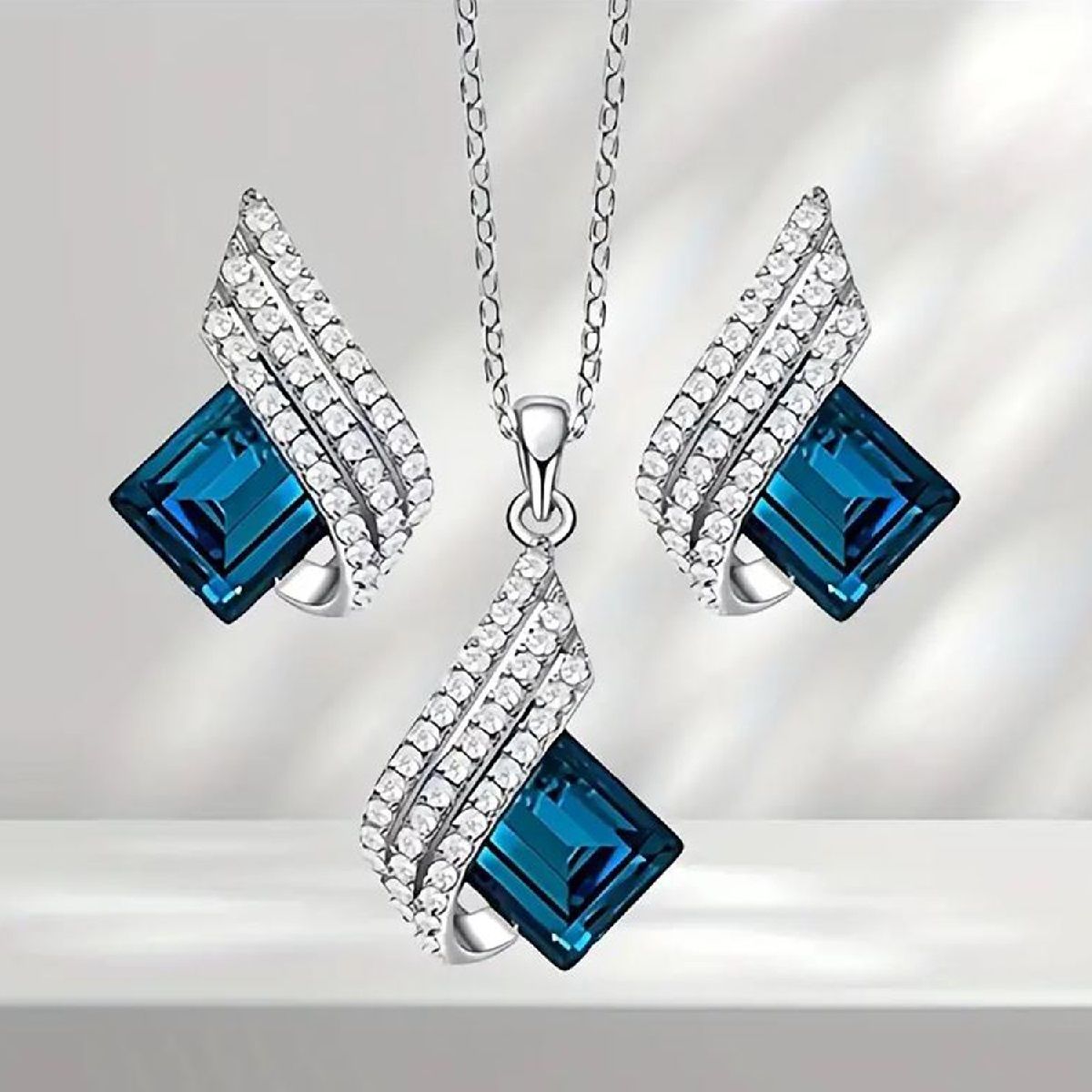 Buy Mahi Shining Angel Wings Montana Blue and White Crystal Pendant Necklace Earrings Set Online
