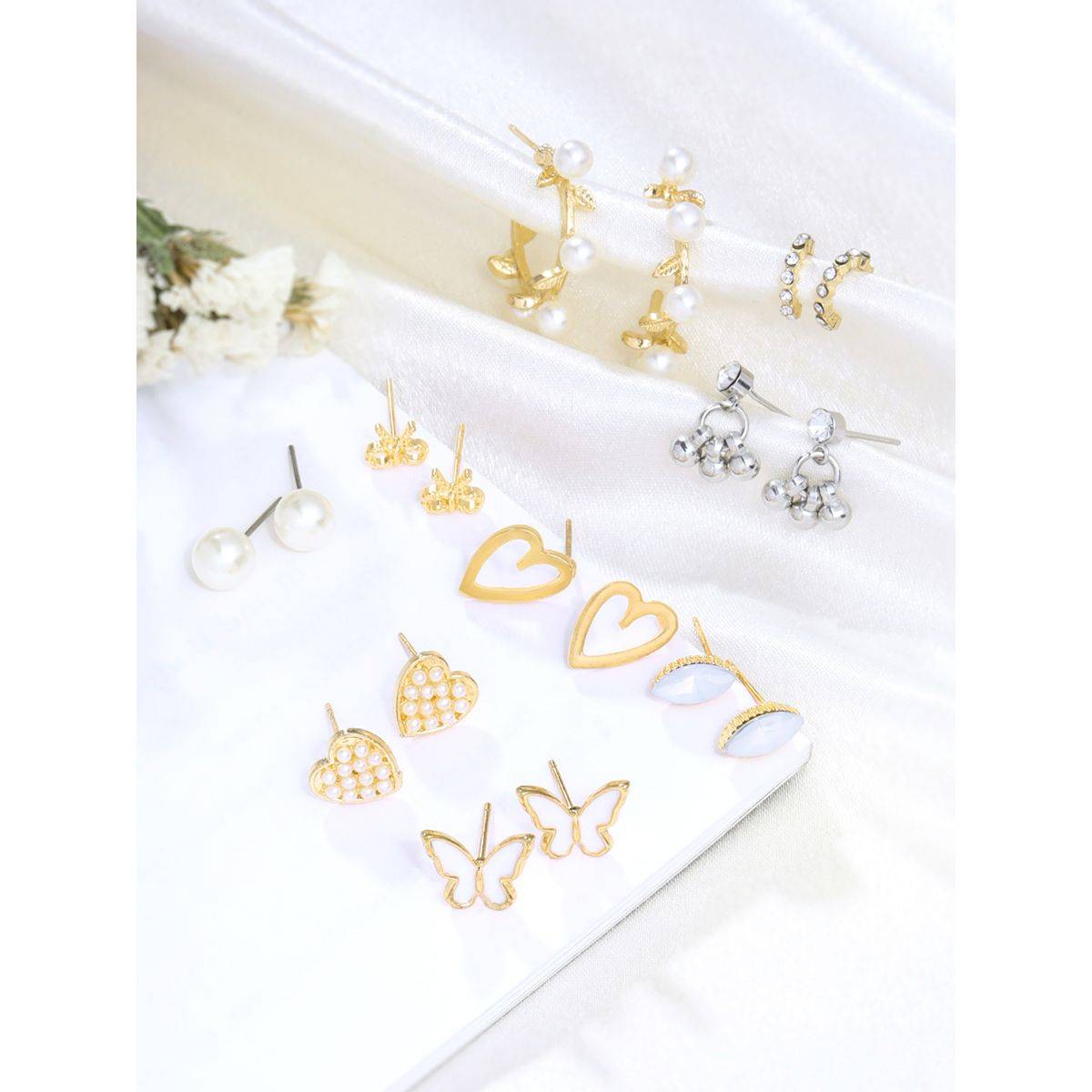 Yellow Chimes Gold Pearls Studded Hoops- Combo Of 9 Pair