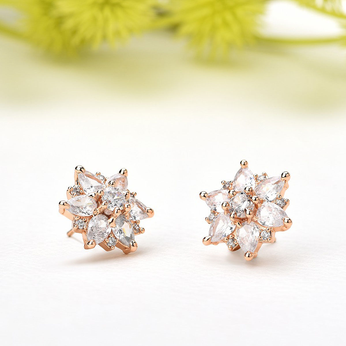 Buy Zaveri Pearls Rose Gold Cubic Zirconia Flower Brass Stud