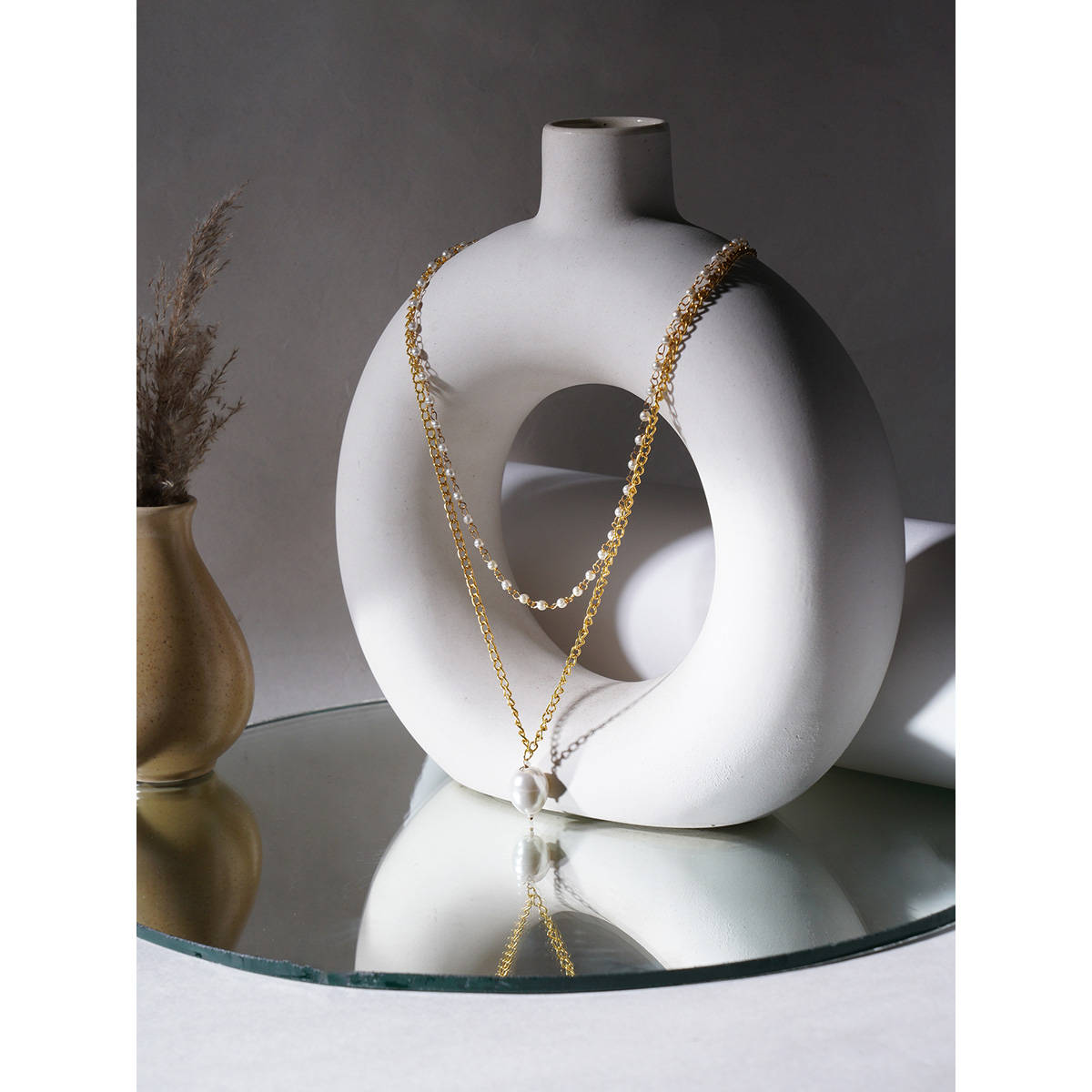 Ruby Raang Studio Layered White Pearl and Gold Neckpiece with Emeralds
