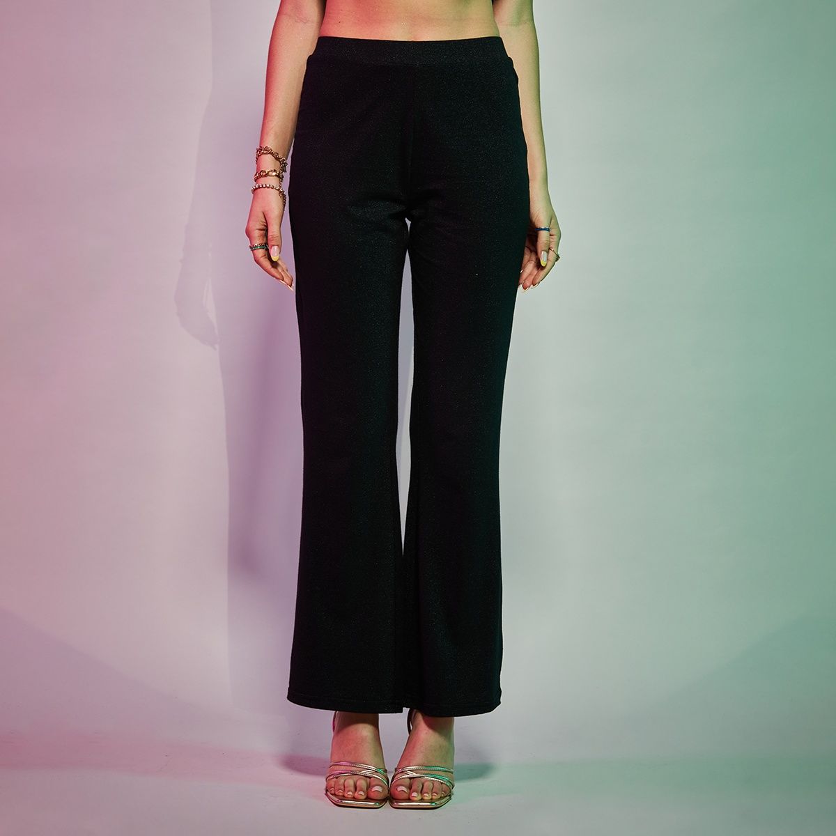 Buy Black High Rise Flared Shimmer Pants Online In India.