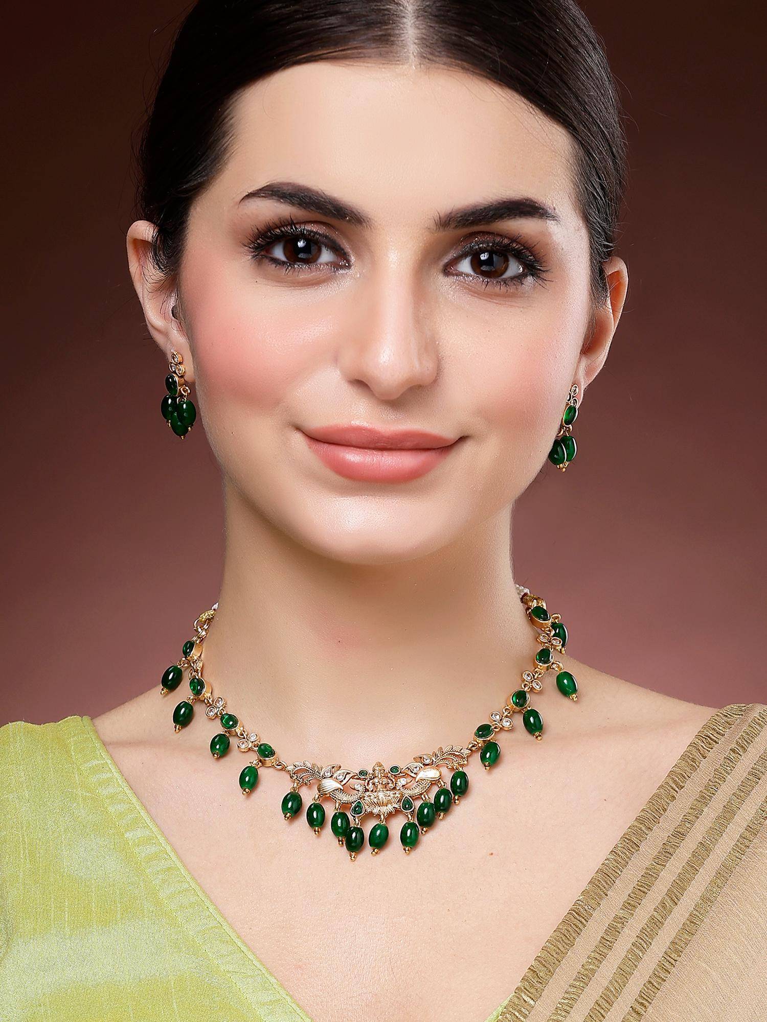 Karatcart Green Tumble Stone Gold Plated Laxmi Mata Temple Necklace With Earrings