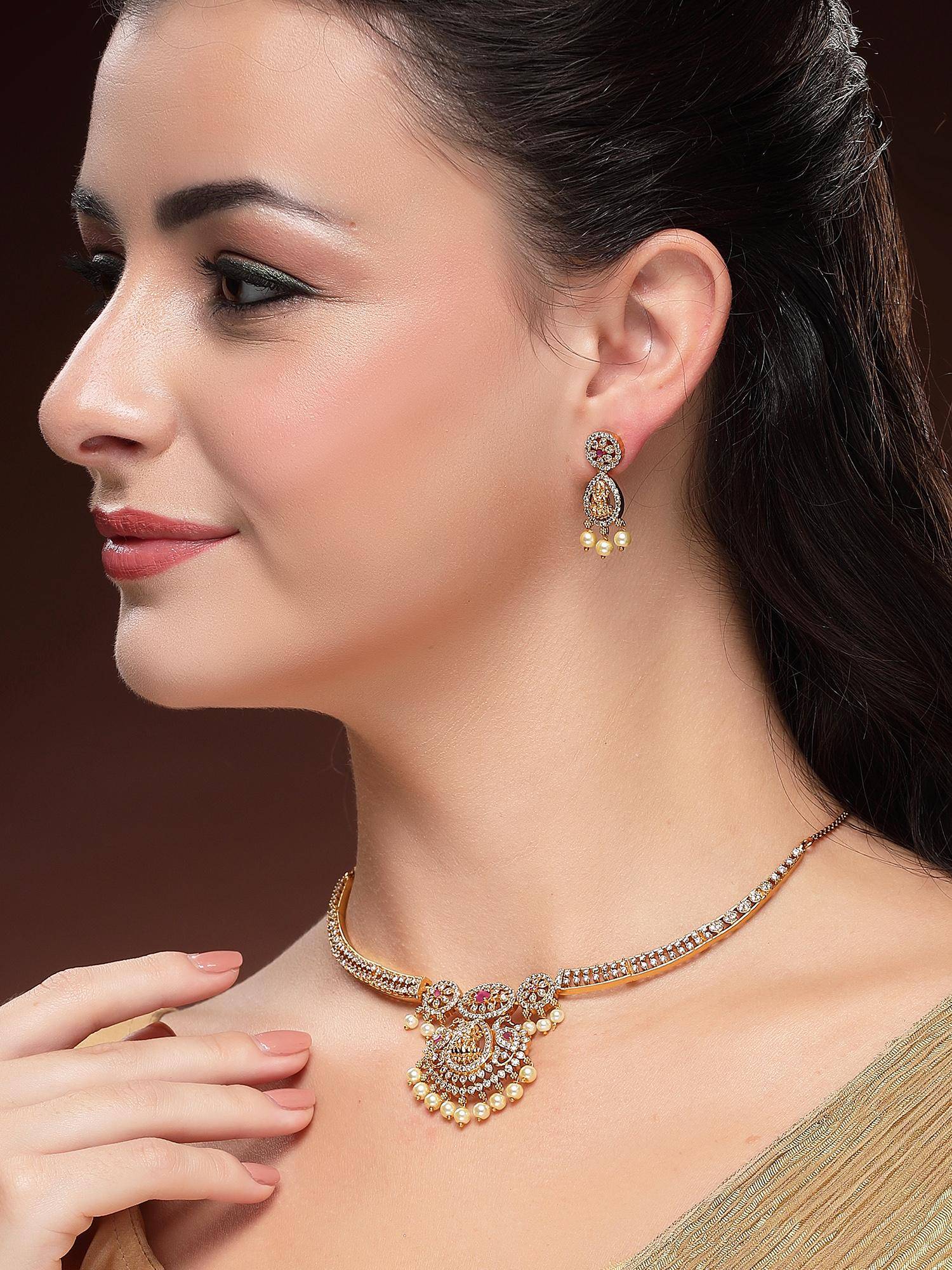 Karatcart Delicate Gold-Plated Red Stone Studded Laxmi Mata Temple Necklace With Earrings