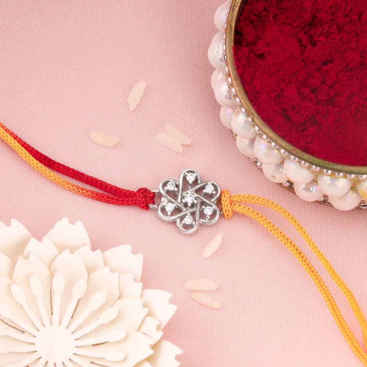 GIVA Sterling Silver Floral Rakhi In Silver