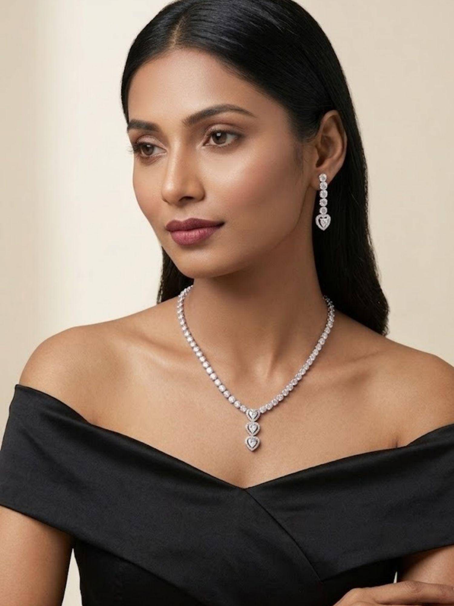 Niscka Rhodium Plated Triple Heart AD Tennis Necklace with Earrings