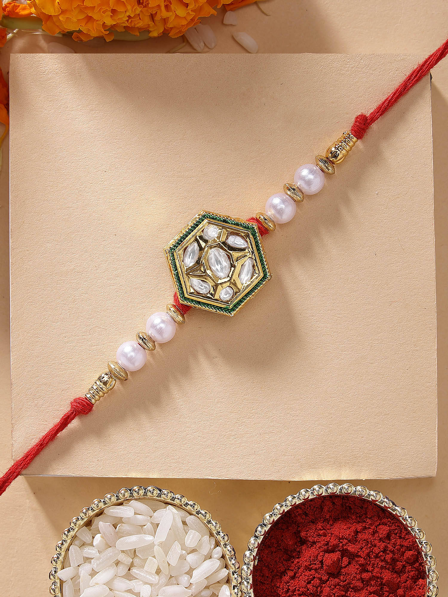 Karatcart Elegant White Pearl and Polki Kundan Handmade Rakhi with Roli Chawal