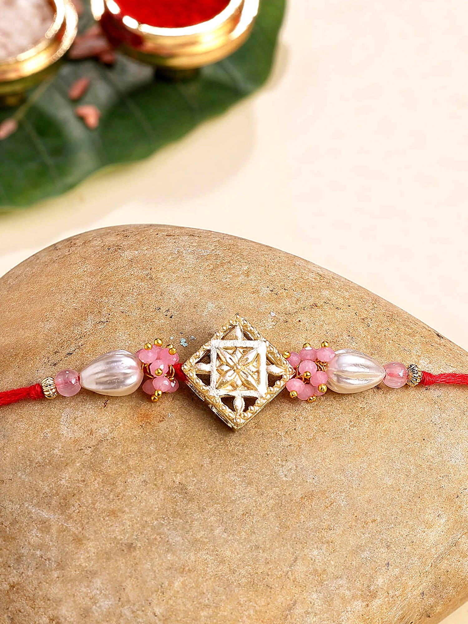 Karatcart Multi-Color Gold Plated Crystal and Pearl Kundan Bhaiya Rakhi with Roli & Chawal