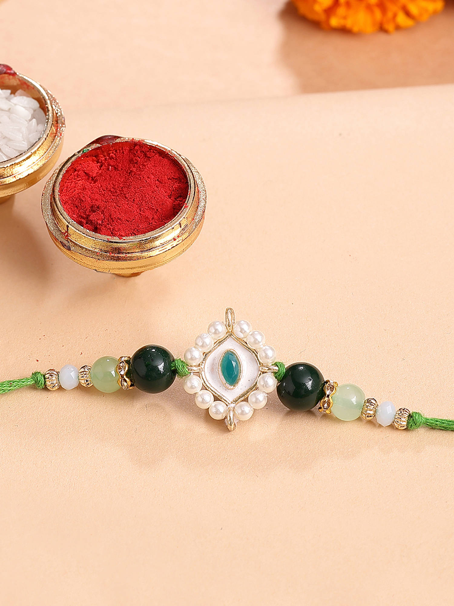 Karatcart Gold Plated Green Evil Eye Kundan Bhaiya Rakhi with Roli & Chawal