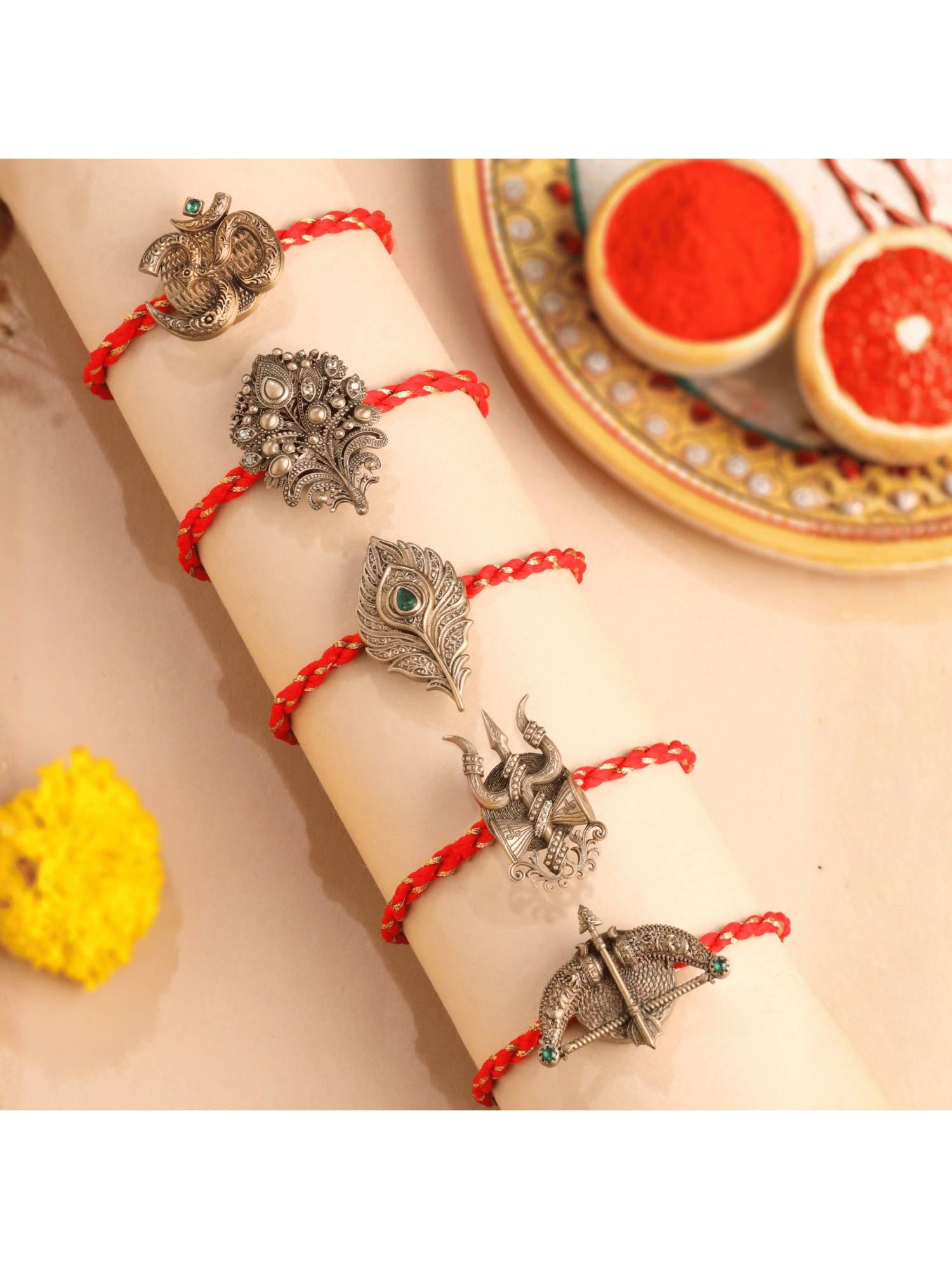 Cosa Nostraa Dhanush, Om, Trishul, Mor Pankh And Divine Gemstone Premium Rakhi (Pack Of 5)