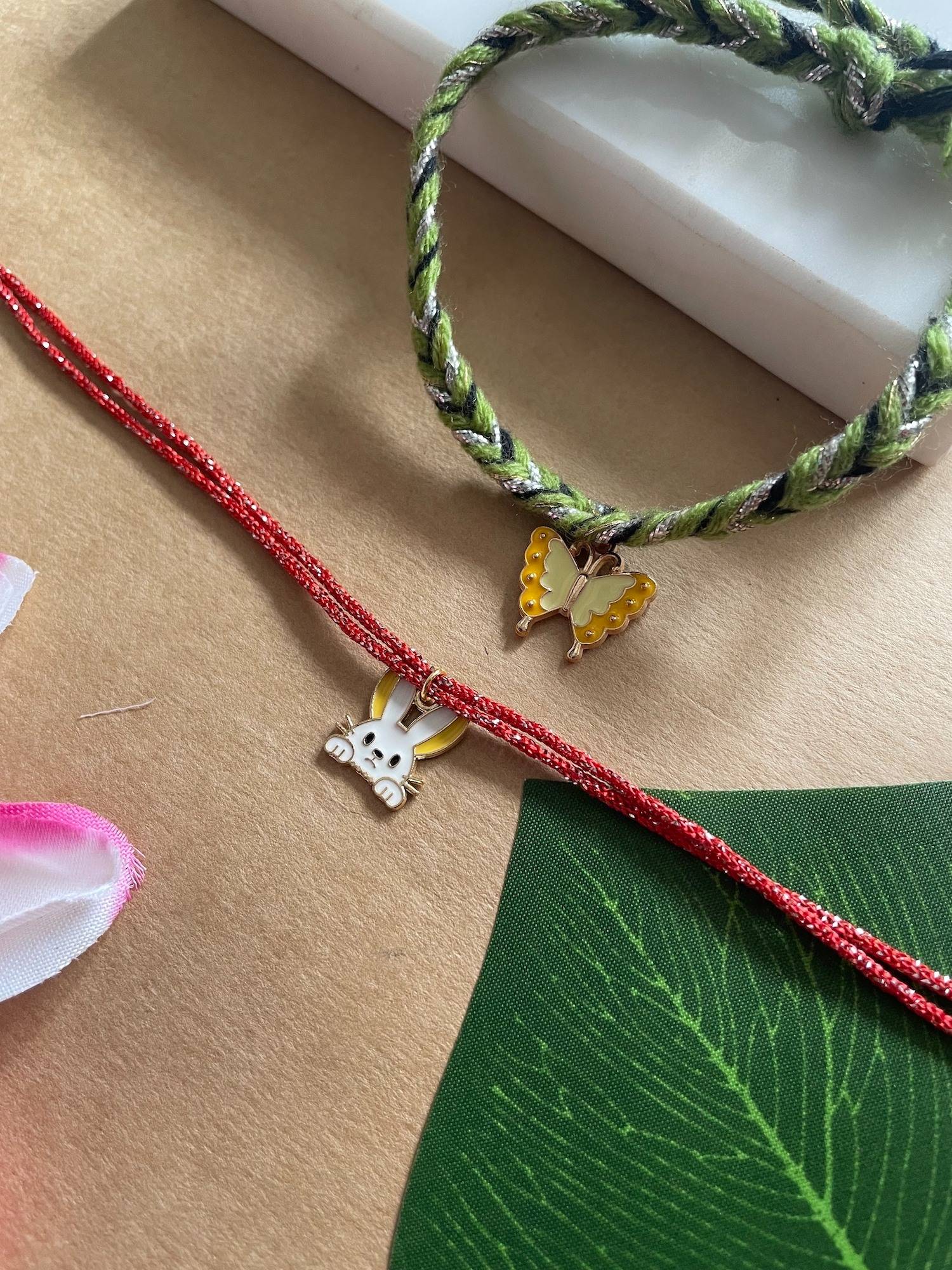 Digital Dress Room Gold Plated Butterfly and Rabbit Charms Rakhis (Pack of 2)