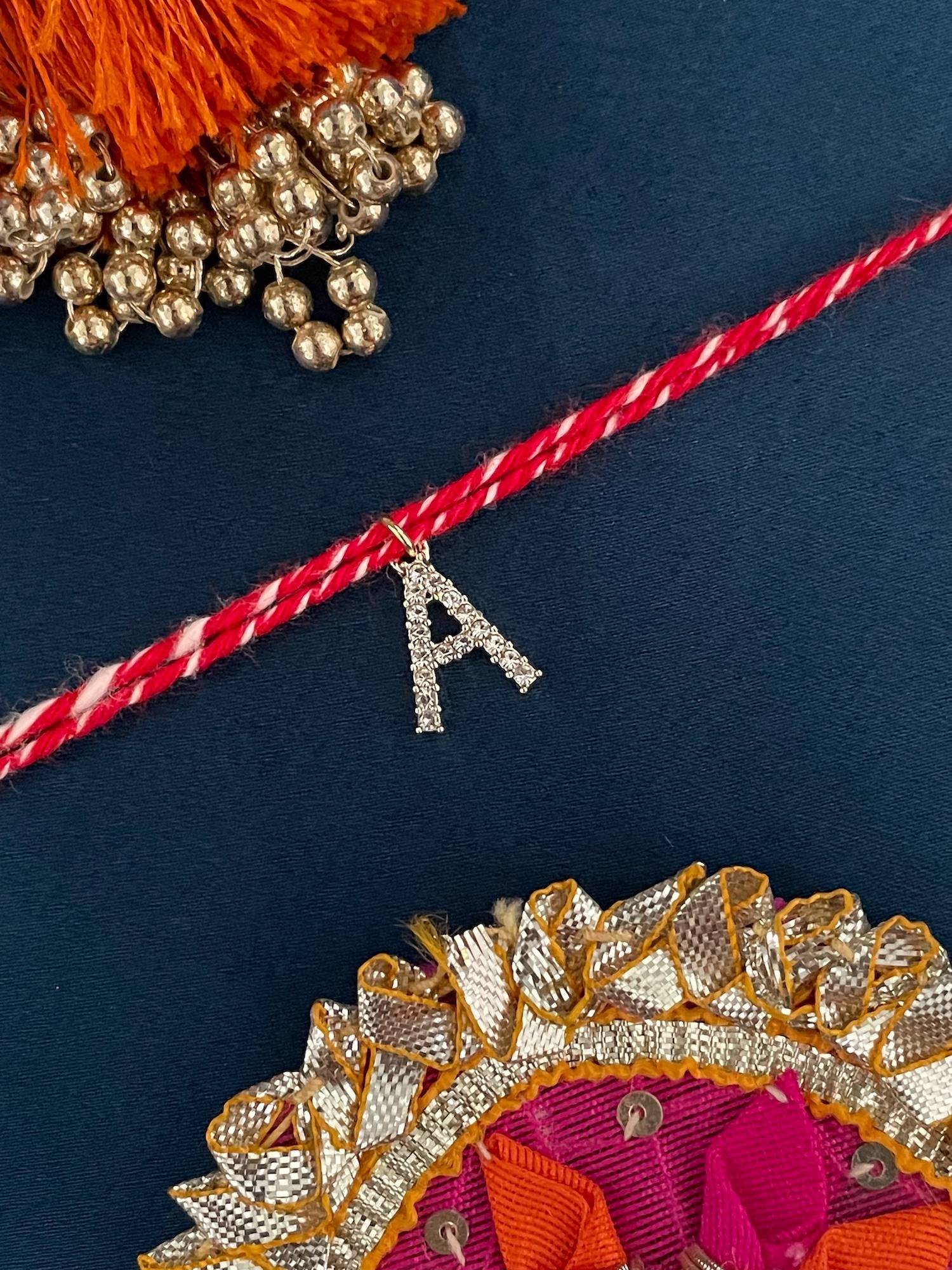 Digital Dress Room A Letter Gold Plated Ad Stone Initial Charm Rakhi