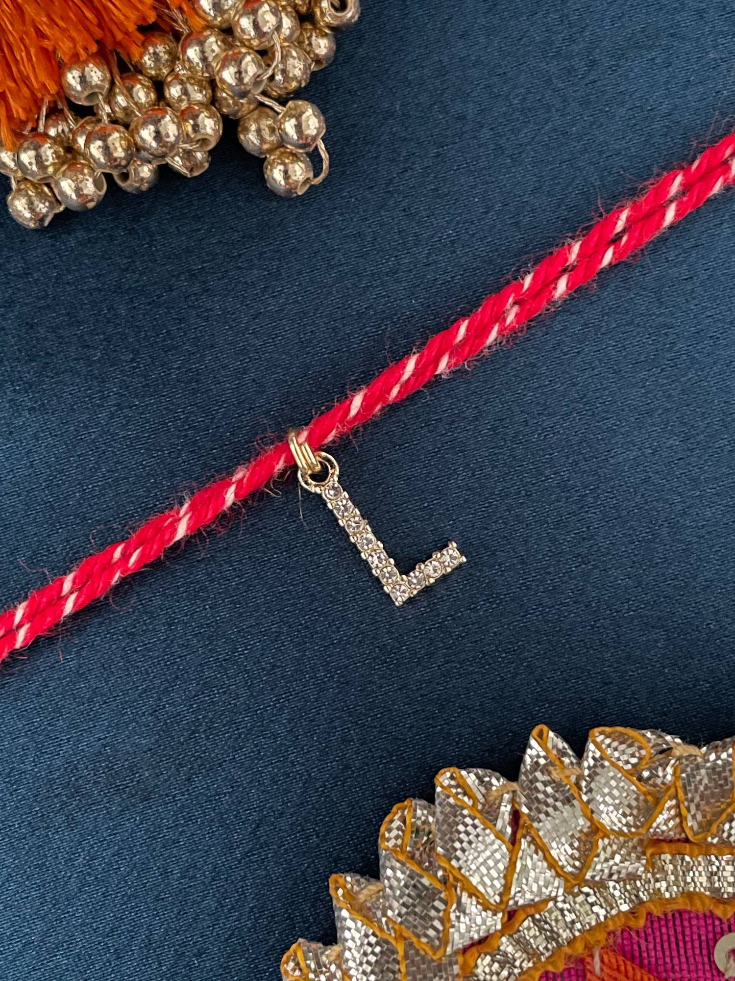 Digital Dress Room L Letter Gold Plated Ad Stone Initial Charm Rakhi