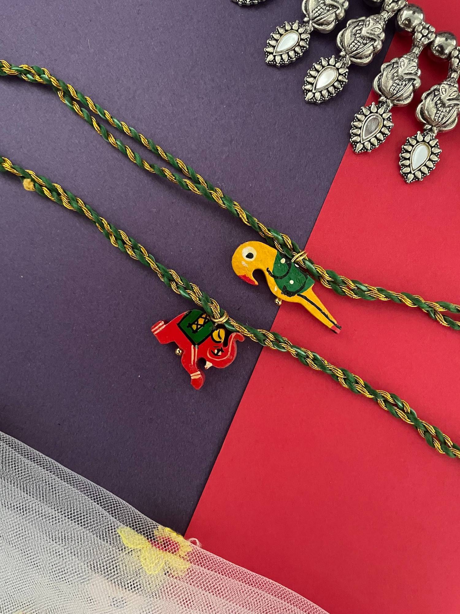 Digital Dress Room Wooden Parrot and Elephant Rakhis (Pack of 2)