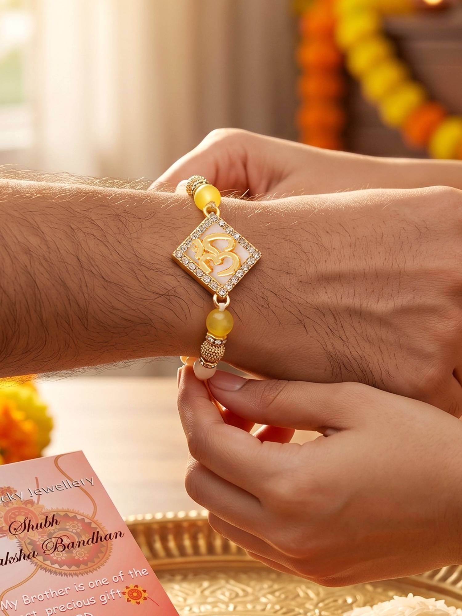 LUCKY JEWELLERY Designer Square Om Gold-Tone Rakhi For Brother With Roli Chawal and Card