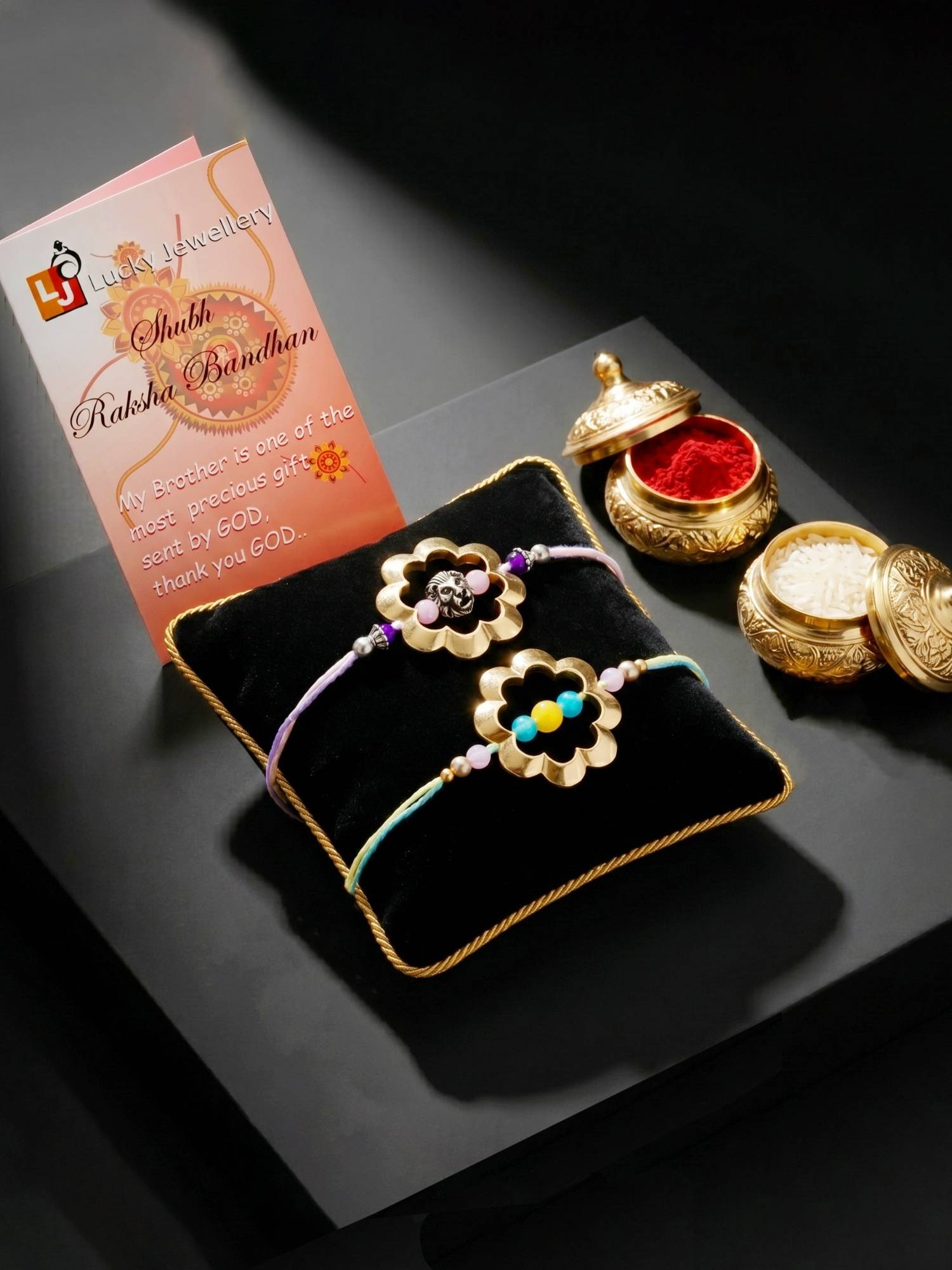 LUCKY JEWELLERY Golden Hollow Flower Lion Motif Rakhi, Roli Chawal and Card (Pack of 2)
