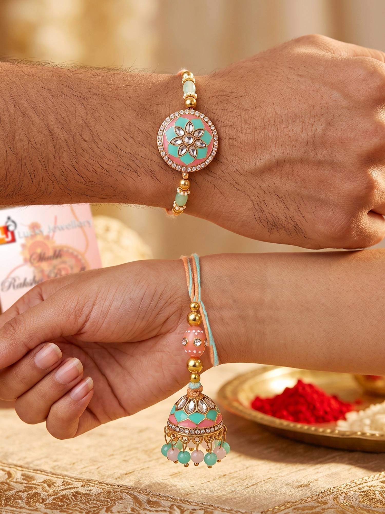 LUCKY JEWELLERY Pastel Green Pink Kundan Lumba Bhaiya Bhabhi Rakhi, Roli Chawal (Pack of 2)