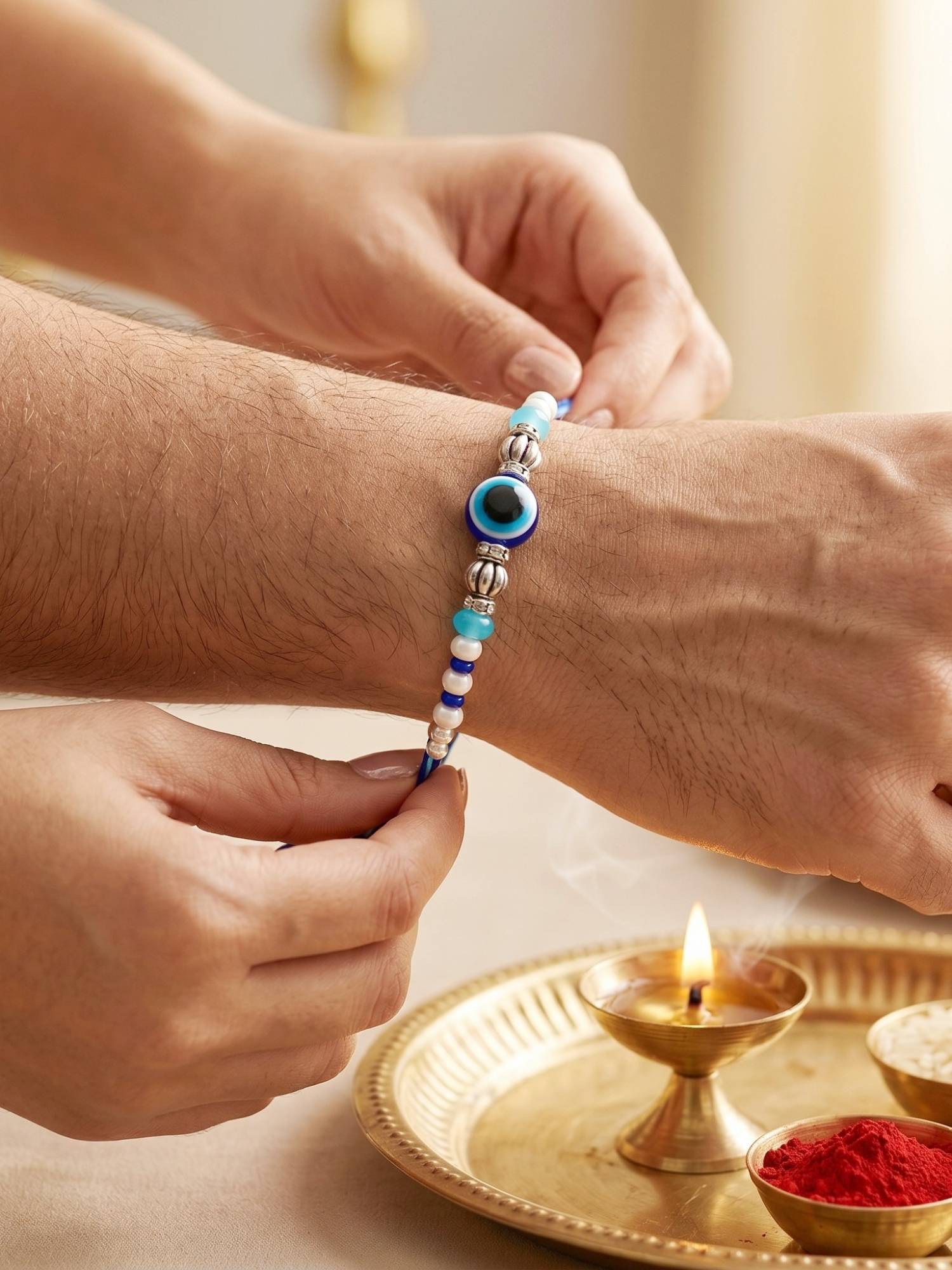LUCKY JEWELLERY Blue Evil Eye Rakhi with Greeting Card and Roli Chawal Set for Raksha Bandhan