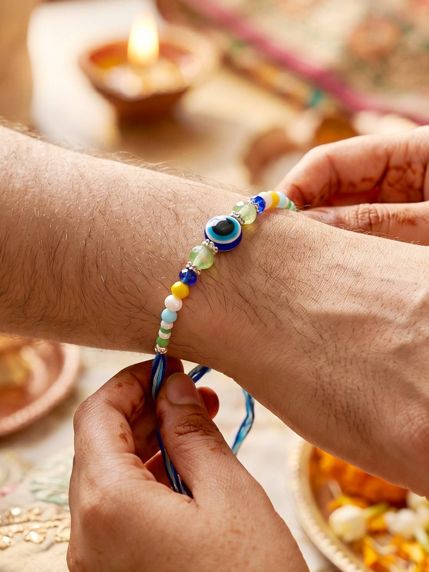 LUCKY JEWELLERY Blue Evil Eye Rakhi with Greeting Card and Roli Chawal Set for Raksha Bandhan