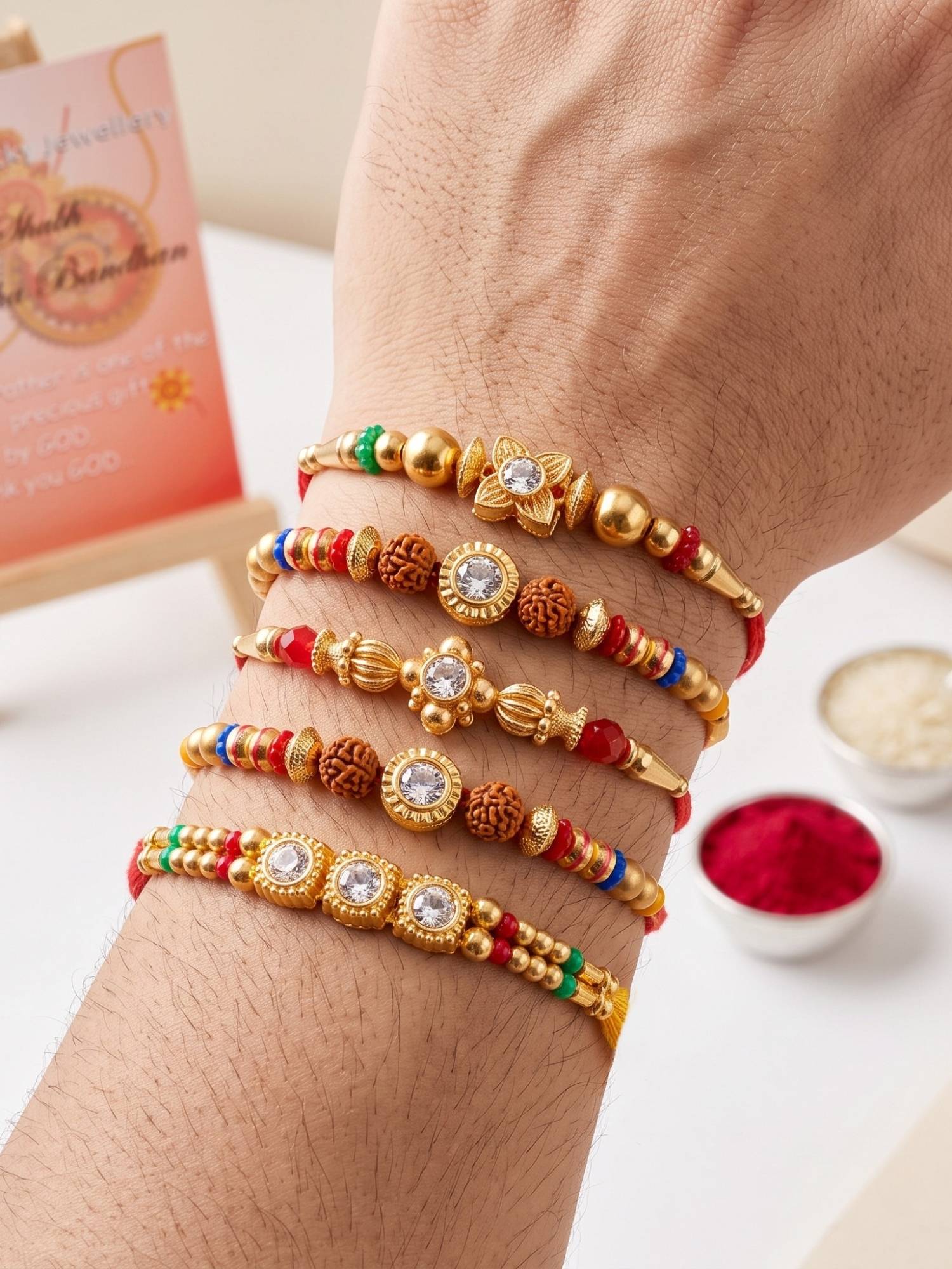 LUCKY JEWELLERY Rakhi with Small Crystal Centrepieces, Gold-Tone and Multicolour Beads (Pack of 5)