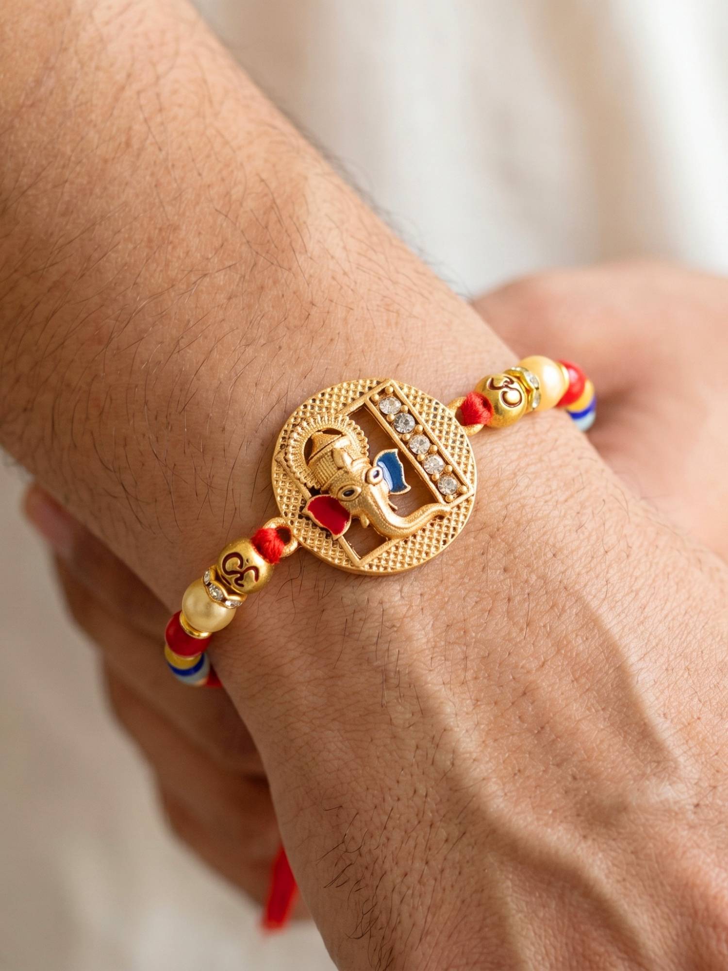 LUCKY JEWELLERY Ganesha and Spiritual Om Beaded Rakhi Set For Brother Roli Chawal and Card