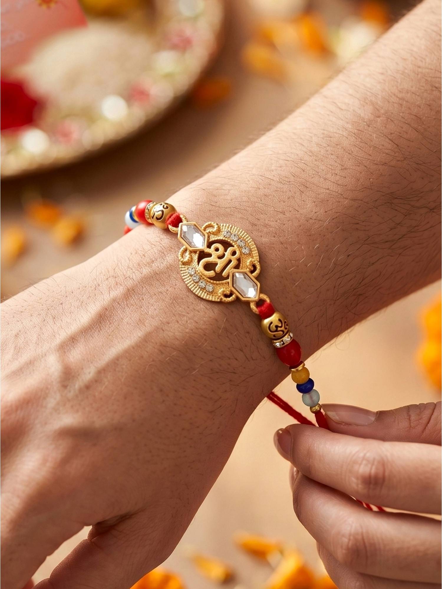 LUCKY JEWELLERY Spiritual Om Beaded Rakhi Set for Brother Roli Chawal, Card