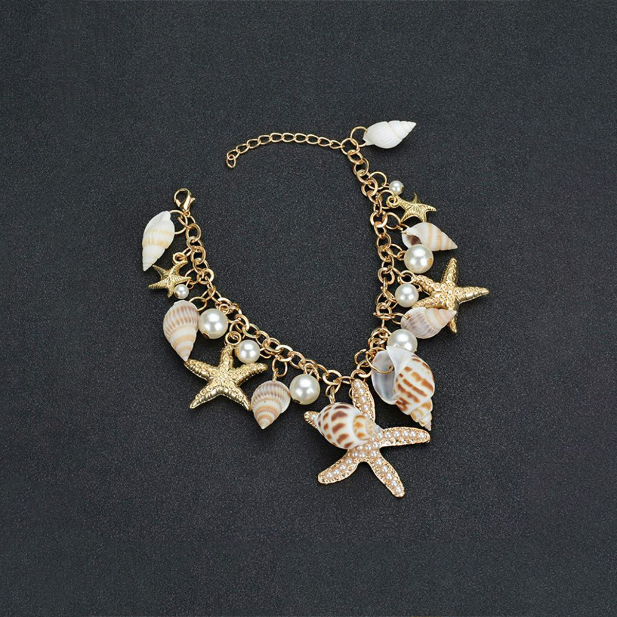 Yellow Chimes Women Goldtoned Sea Shell Starfish and Pearls Hanging Charm  Bracelet Buy Yellow Chimes Women Goldtoned Sea Shell Starfish and Pearls  Hanging Charm Bracelet Online at Best Price in India 