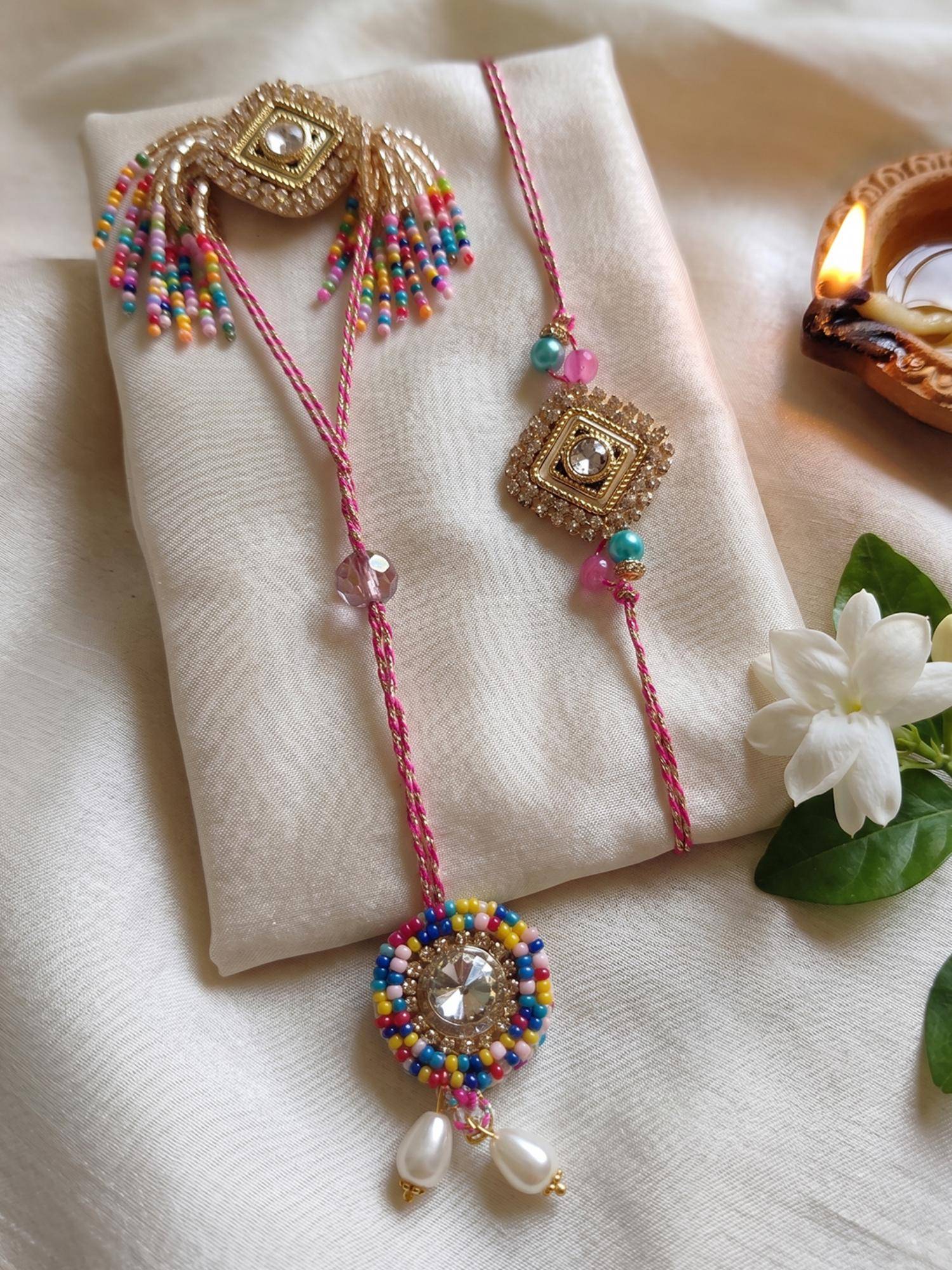 NVR Multi-Color Artificial Stones Golden Toned Bhaiya Bhabhi Rakhis (Pack of 2)