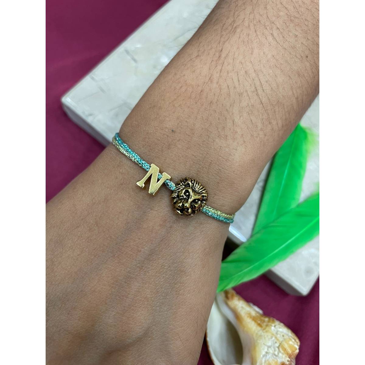 Digital Dress Room Letter O Lion Charm Thread Rakhi