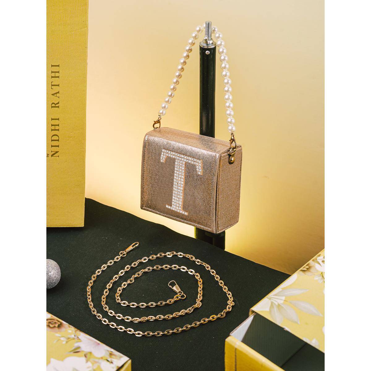 NR BY NIDHI RATHI Golden T Alphabet Initial Embellished Flap Clutch Bag with Detachable Strap