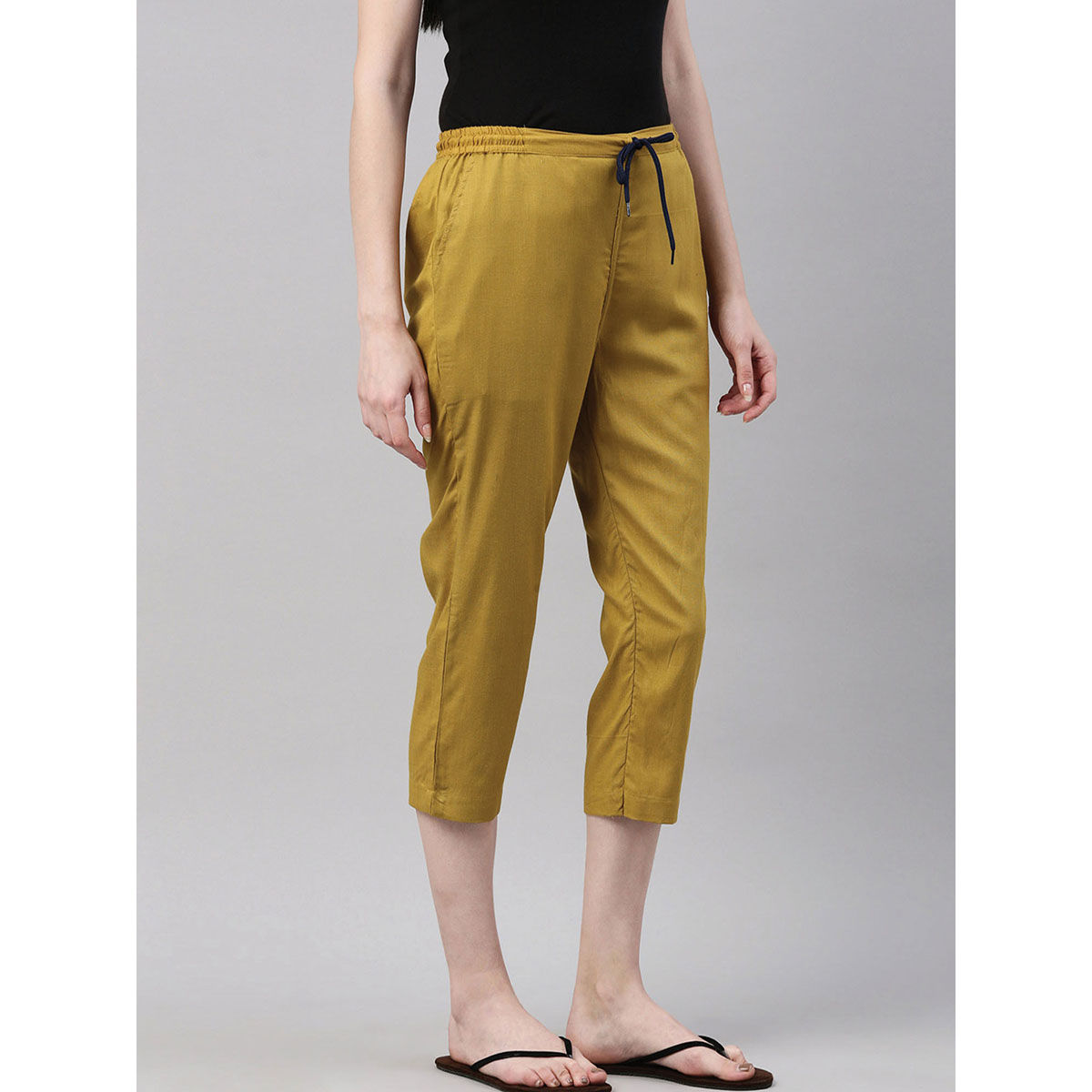 Buy Kryptic Mustard Solid Capris for Women Online