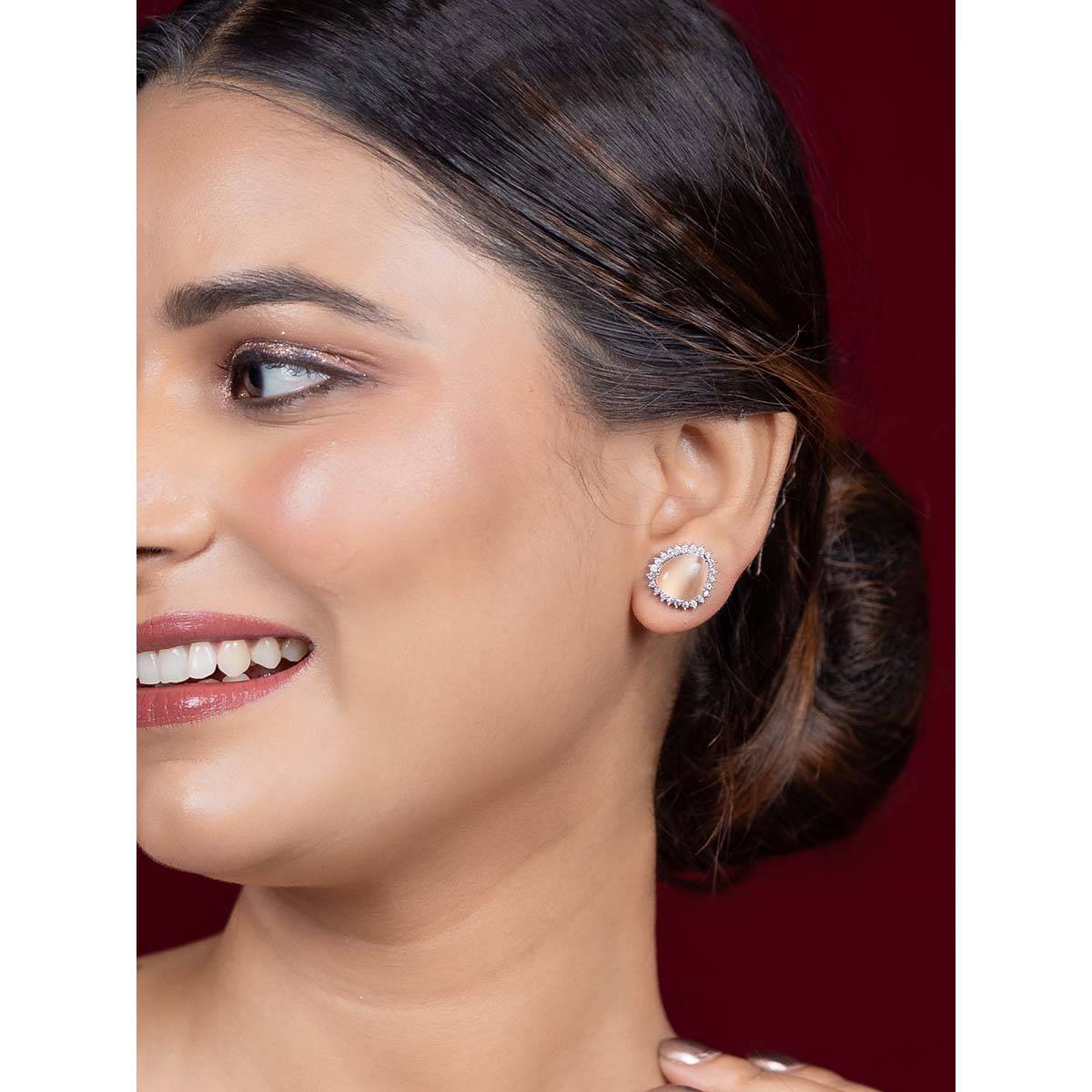 Niscka Peach Water Stud Earrings with American Diamonds and Rhodium Plating
