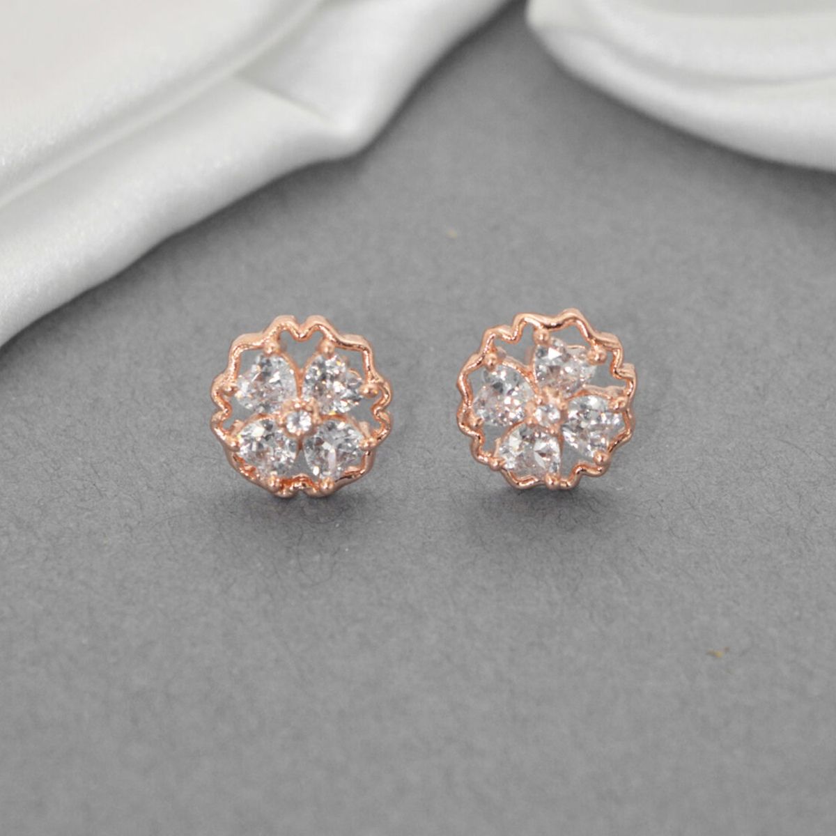 Niscka Stunning American Diamond Ad Rose Gold Plated Stud Earrings: Buy ...