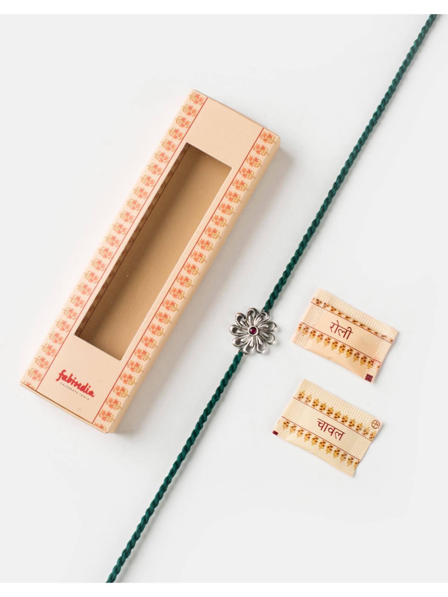 Fabindia Women Pink Stone Silver Floral Thread Rakhi with Roli Chawal