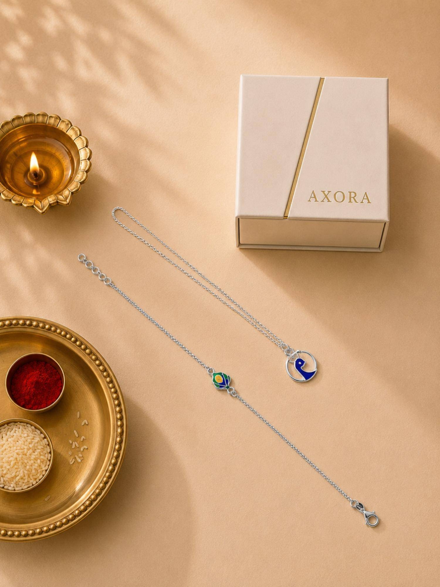 Axora Life 925 Sterling Silver Peacock Bhaiya Bhabhi Rakhi with Lumba and Roli Chawal