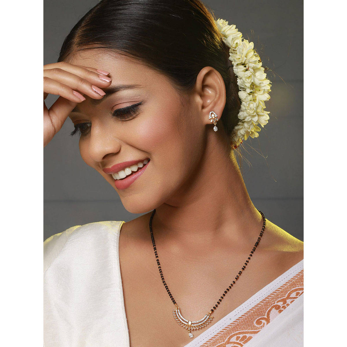 Aatmana Black Gold-Plated Beaded & AD Studded Mangalsutra & Earrings Set