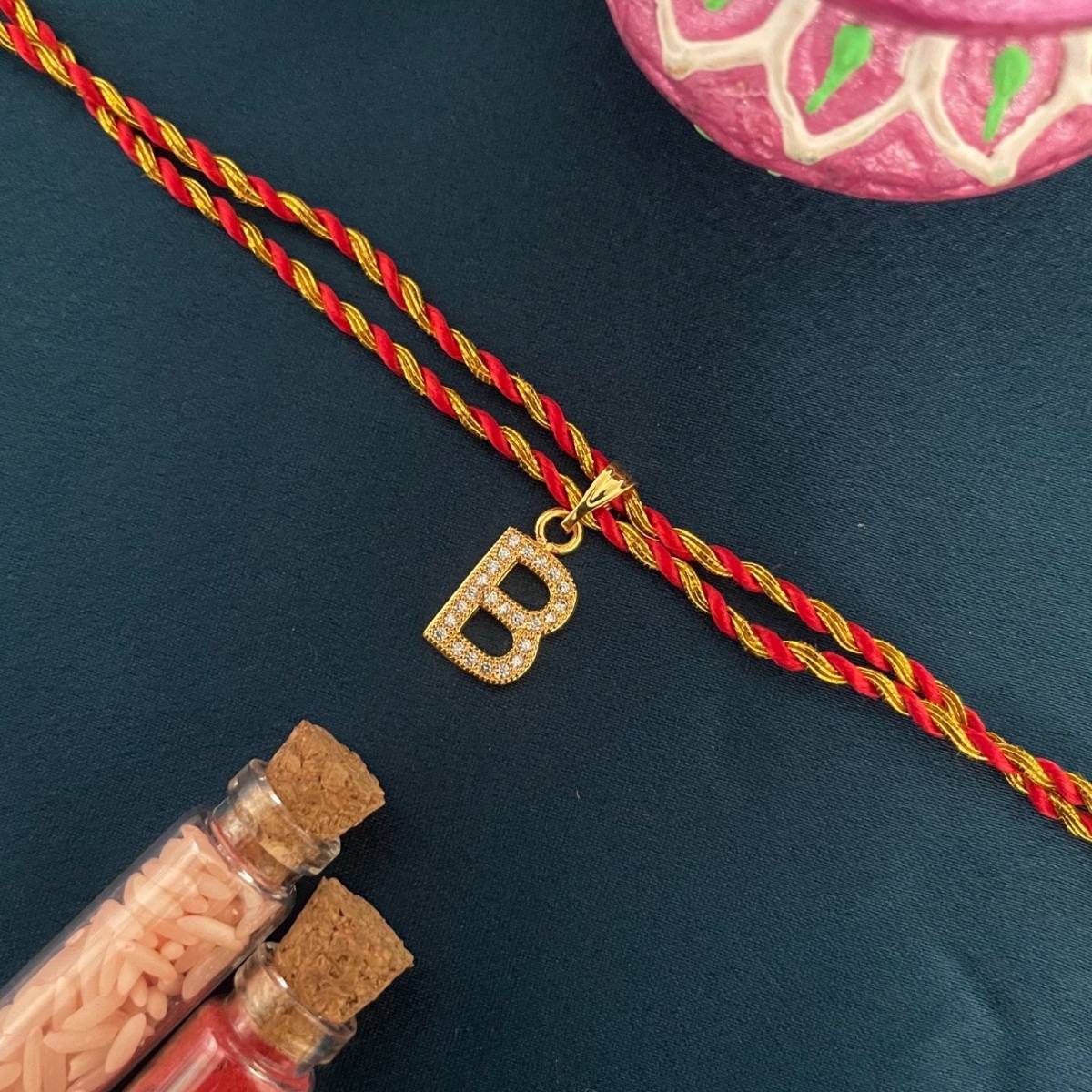 Digital Dress Room Gold B Letter Ad Red Thread Rakhi