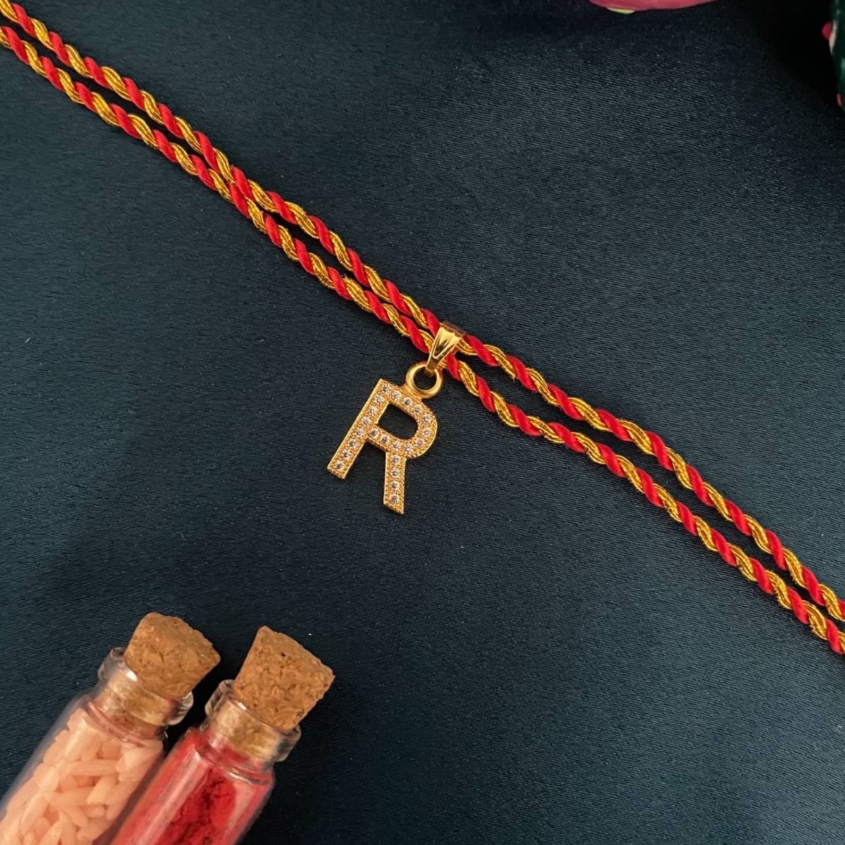 Digital Dress Room Gold R Letter Ad Red Thread Rakhi