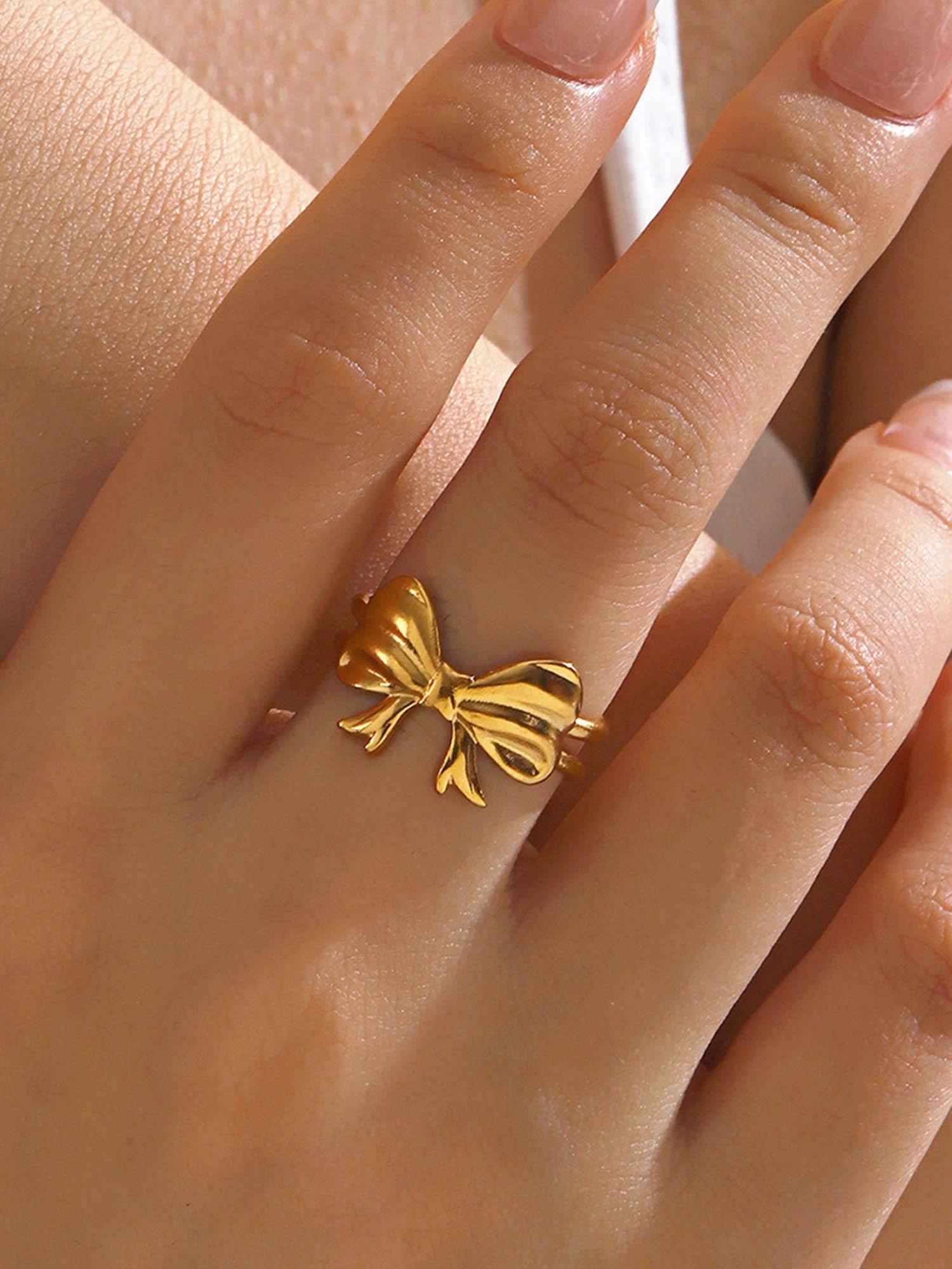 Jewels Galaxy Gold-Plated Anti Tarnish Stainless Steel Bow Themed Adjustable Ring
