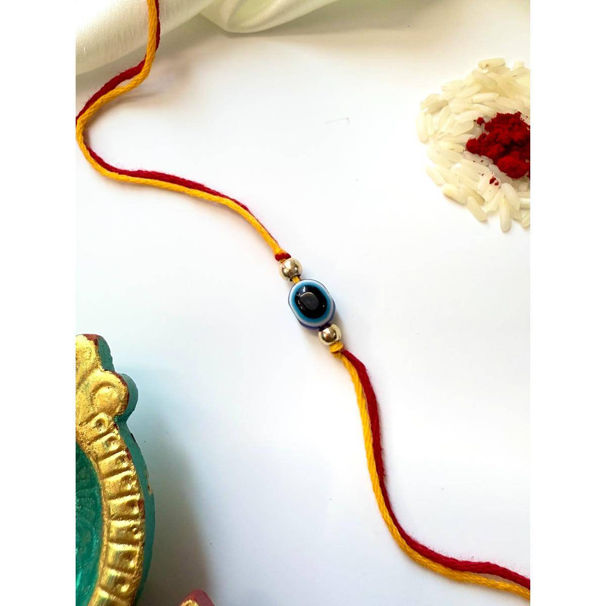 ISHKAARA Evil Eye Energy Rakhi with Roli Chawal