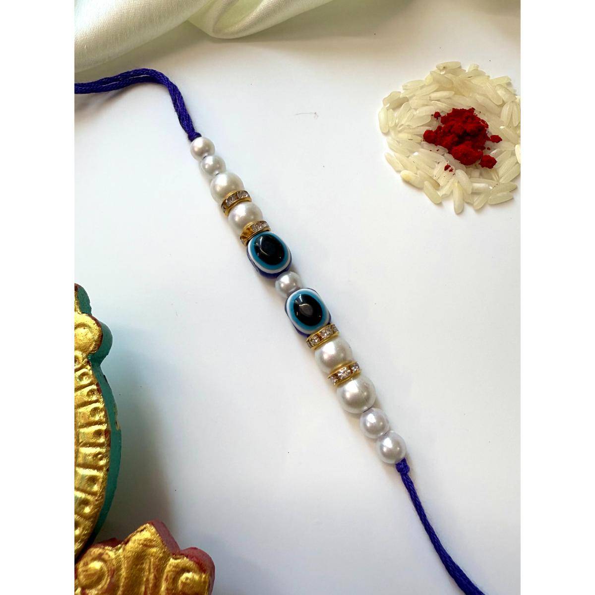ISHKAARA Raksha Pearl Rakhi with Roli Chawal