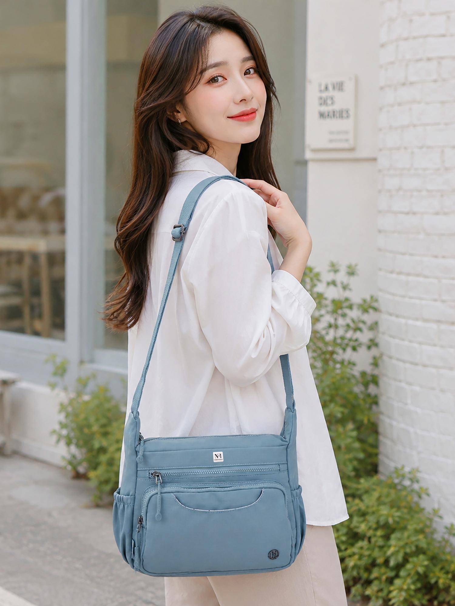 NFI Essentials Multi Pocket Sling Bag for Women Blue