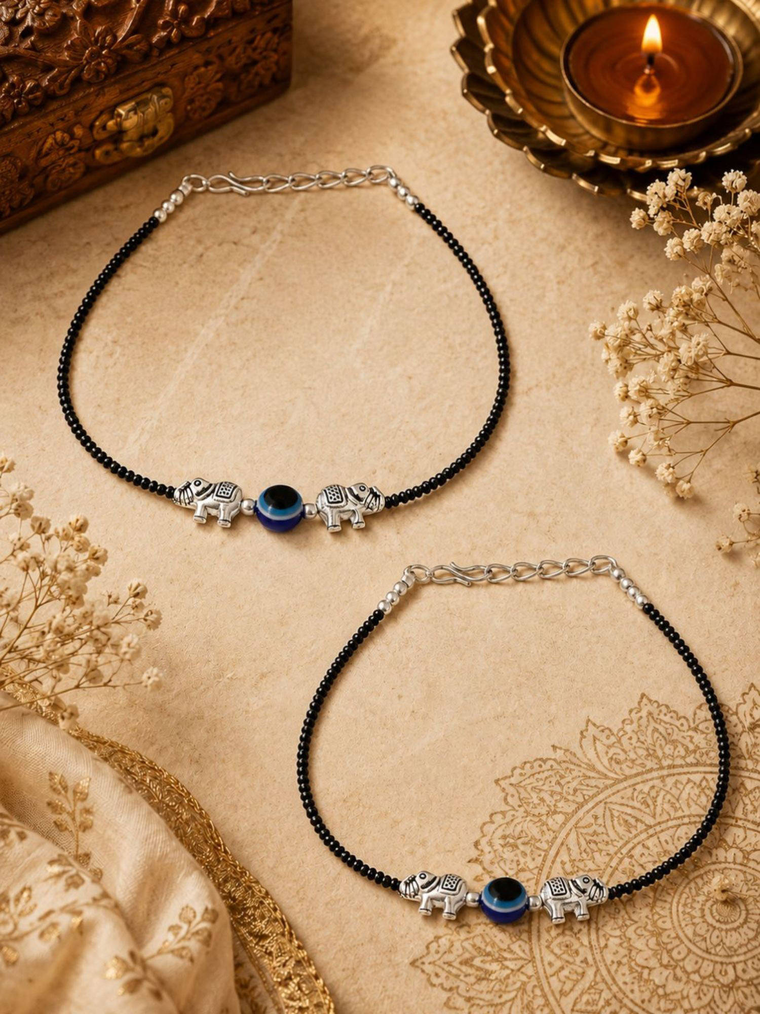 VIRAASI Silver Plated Black Beads Elephant Design Charm Evil Eye Anklets Pair