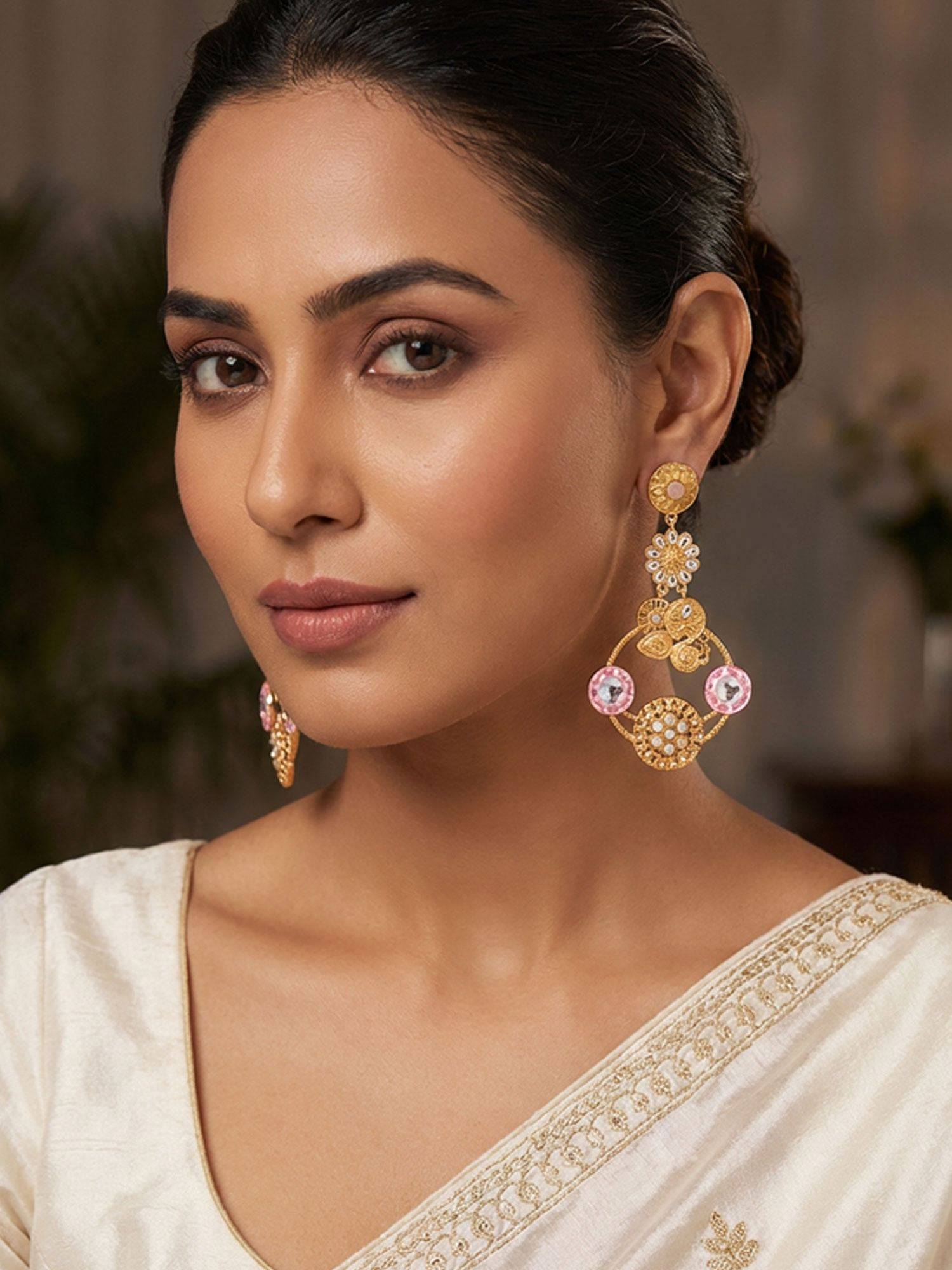 Niscka Matte Gold Plated Peacock Earrings with White Kundan and Pink Stones