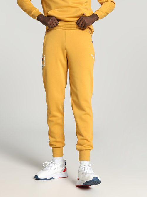 Buy Puma BMW MMS Essentials Fleece Men Yellow Track pant Online