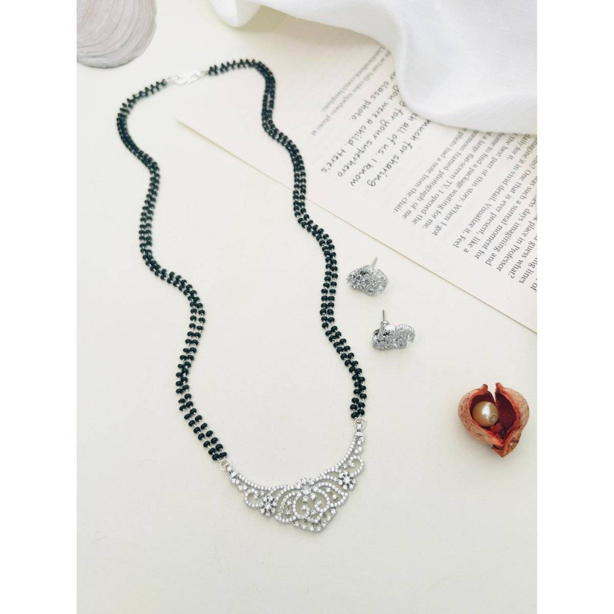 Abdesigns White Silver Plated American Diamond Studded Beaded Mangalsutra with Pair Of Earrings