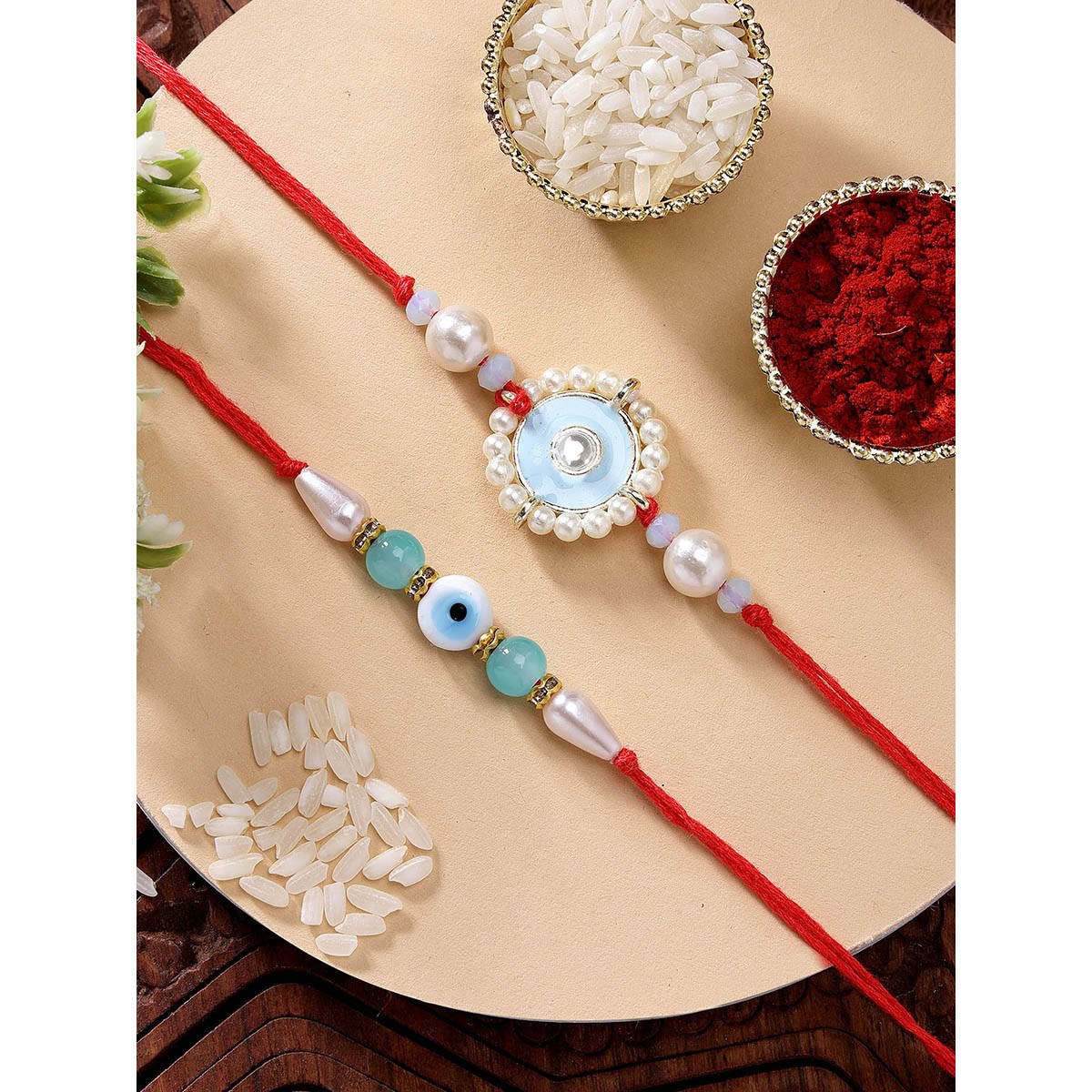 Karatcart Set Of 2 Light Blue Evil Eye Kundan Rakhi with Roli Chawal