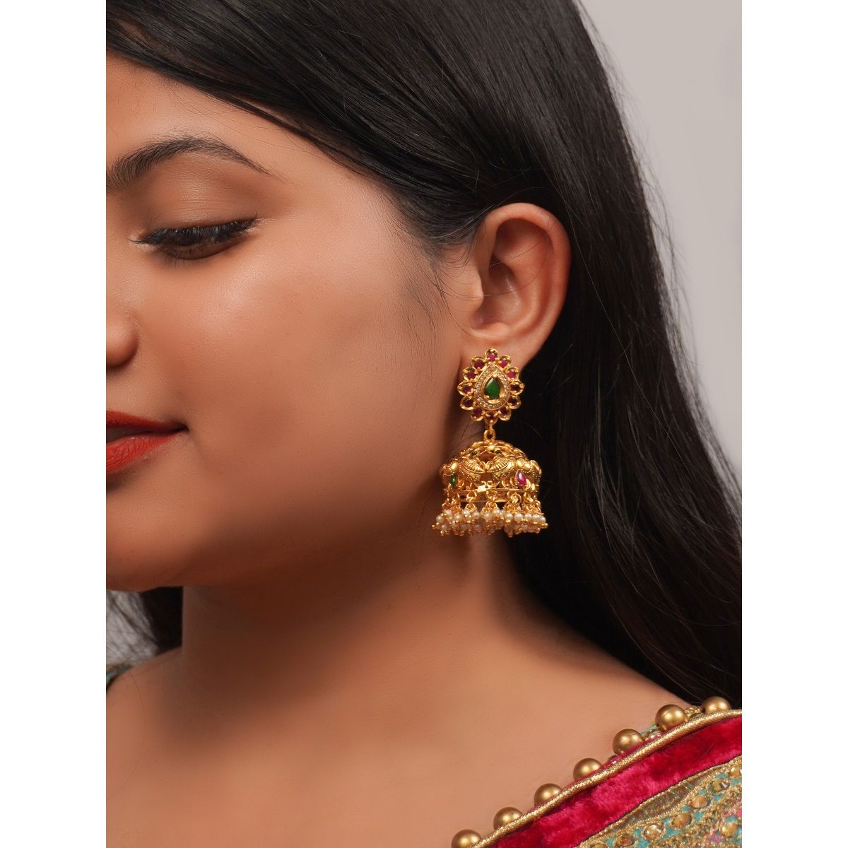 Gold Plated Green Stone Jhumkas by Niscka - Jhumka Earrings Gold