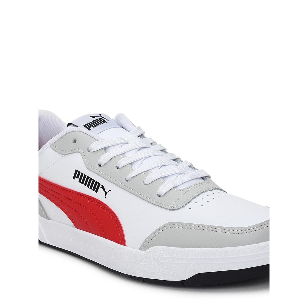 white and red puma trainers