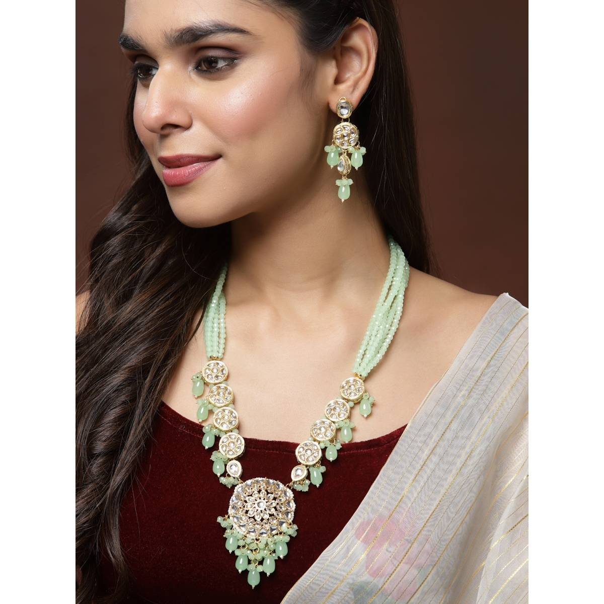 Panash Gold Plated Kundan Studded And Green Pearl Beaded Jewellery Set