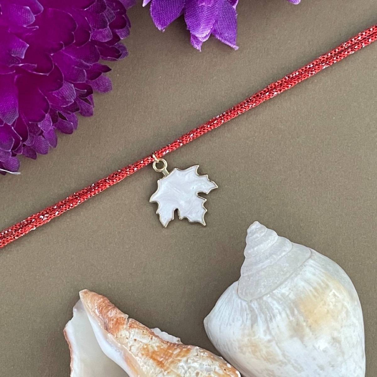 Digital Dress Room Gold Plated White Maple Leaf Charm Rakhi For Raksha Bandhan